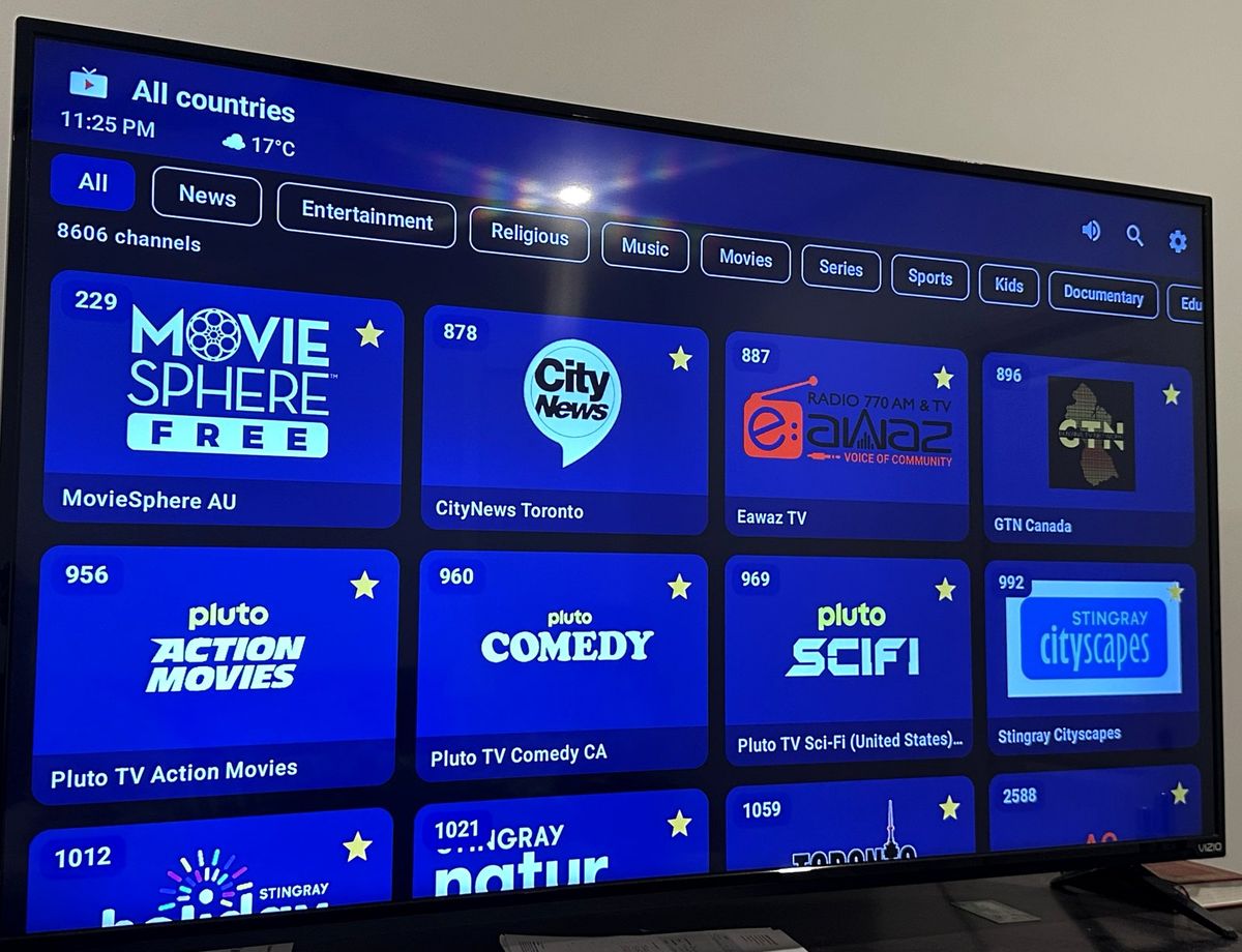 The NextGen Cable app on a television: clock and weather at the top, a row of genres, and channel tiles in two rows